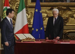 Italian President Sergio Mattarella, right, waits for Italy's Premier Giuseppe Conte, left, during the swearing-in ceremony for Italy's new government at Rome's Quirinale Presidential Palace, Friday, June 1, 2018. (AP Photo/Gregorio Borgia)